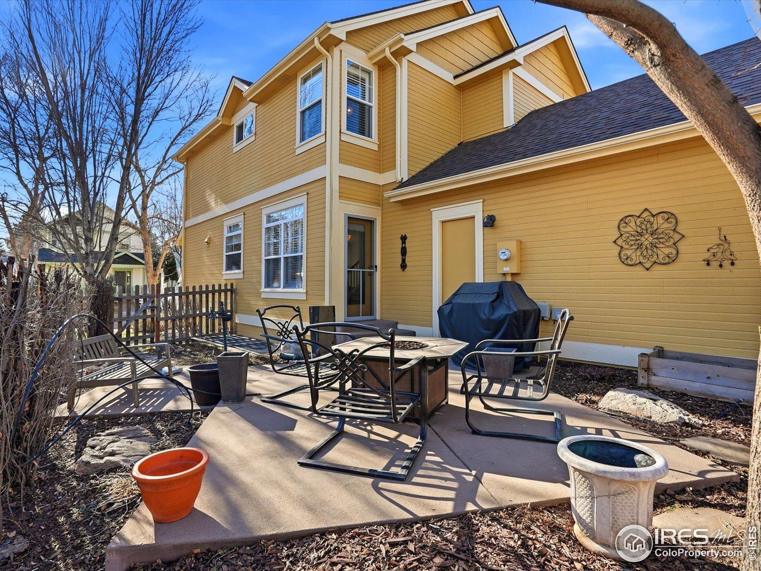 2139 Springs Place Longmont, CO 80504 - Photo 47 of 50 a building outdoor space with patio furniture and potted plants