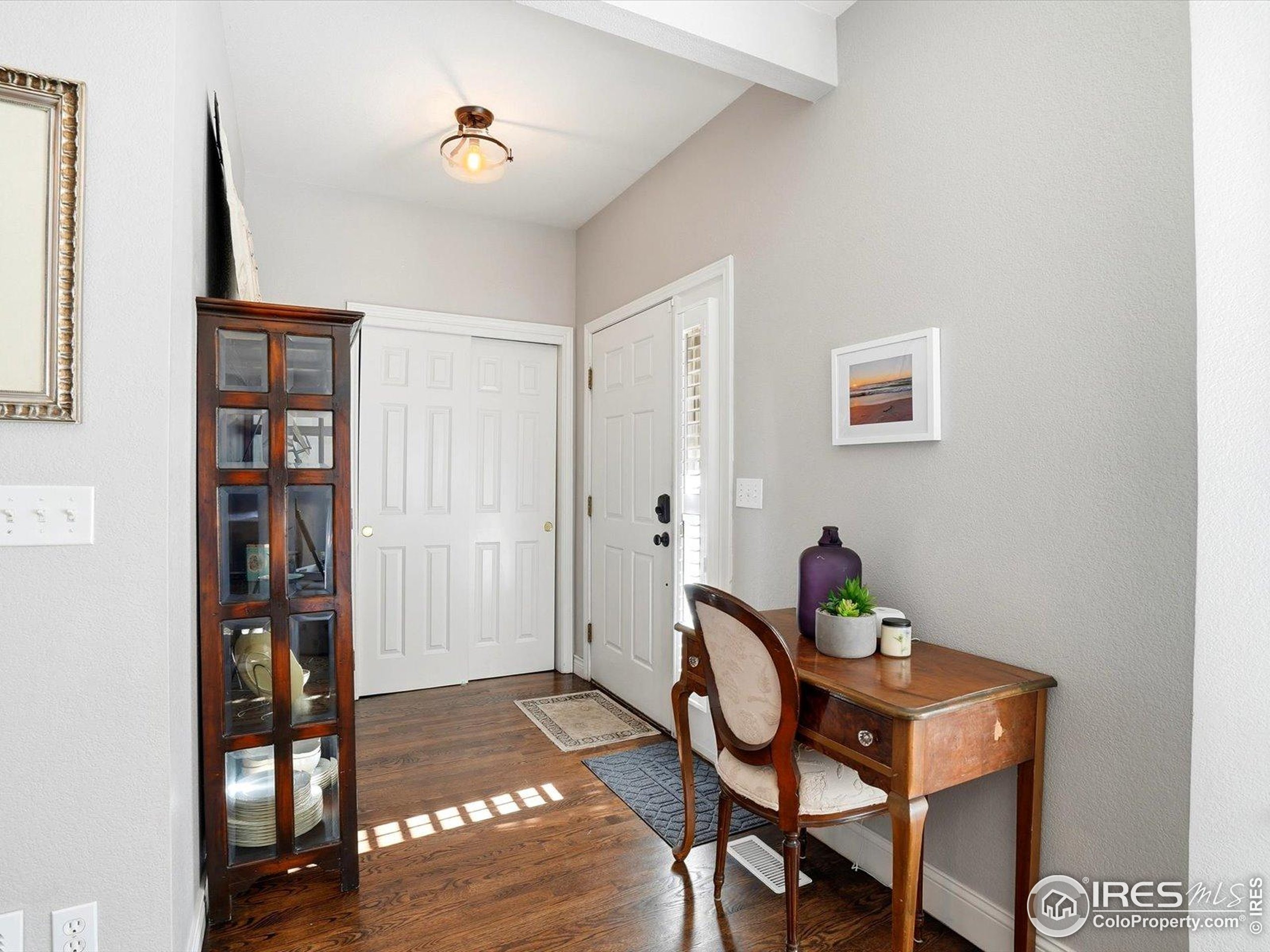 2139 Springs Place Longmont, CO 80504 - Photo 8 of 50 a view of a workspace with furniture and wooden floor