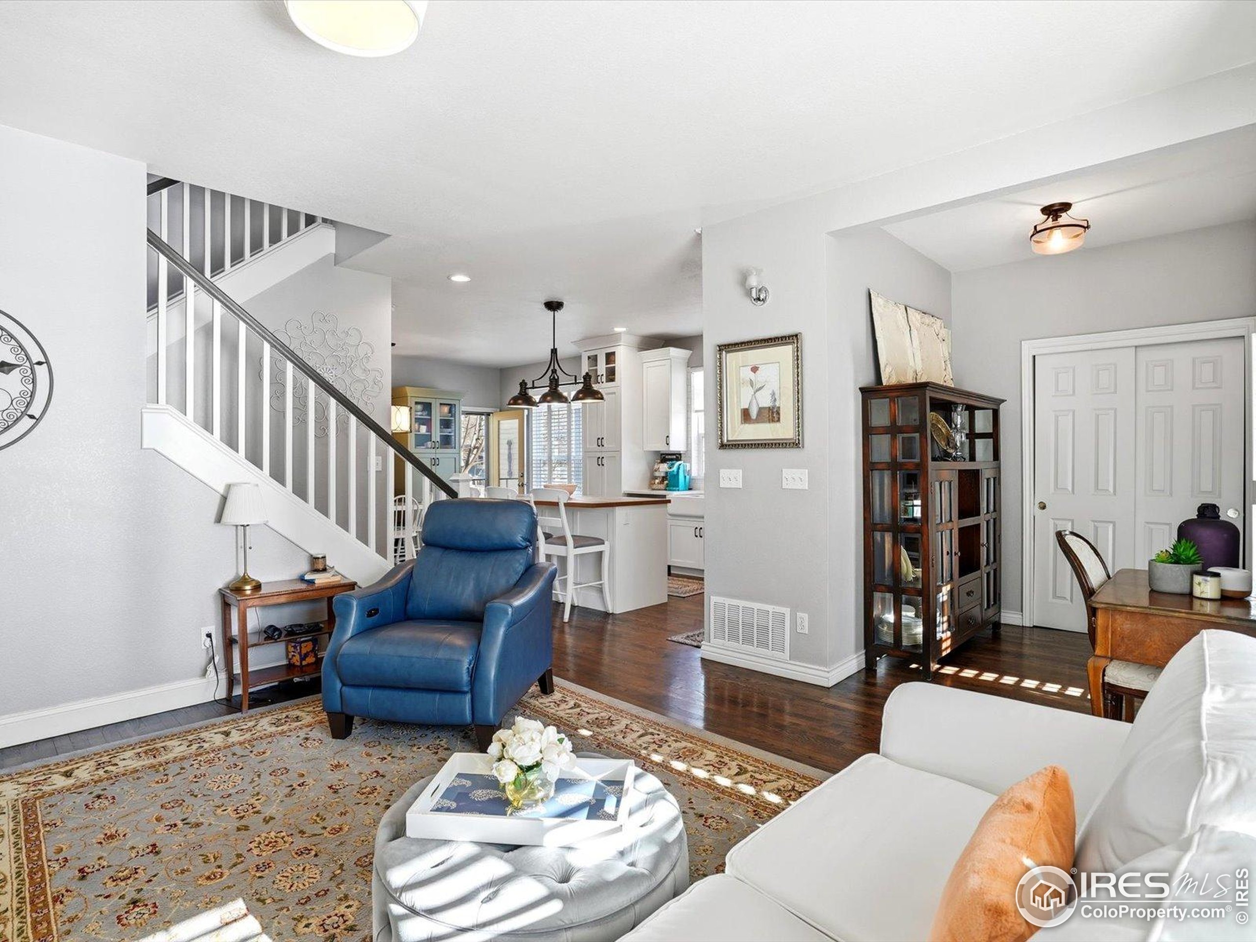 2139 Springs Place Longmont, CO 80504 - Photo 10 of 50 a living room with furniture and wooden floor
