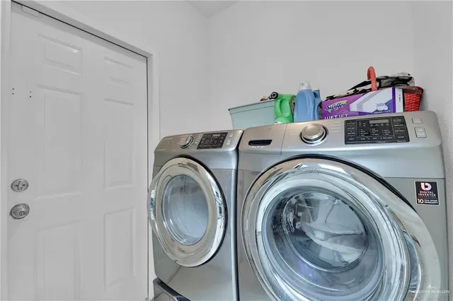 a utility room with dryer and washer