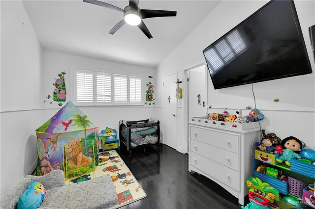 a play room with toys and a flat screen tv