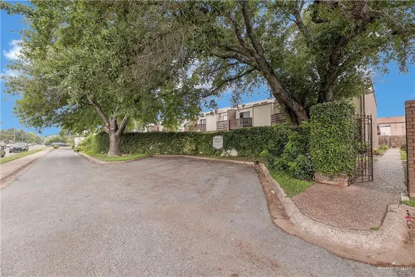 a view of a road with a yard