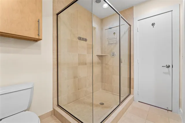 a bathroom with a shower and toilet