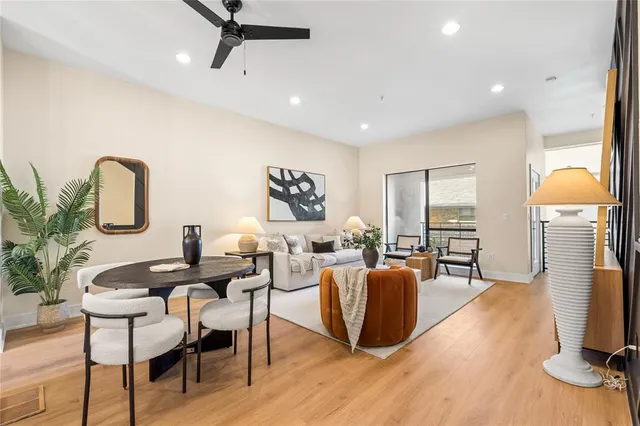 a living room with furniture a fireplace and a table