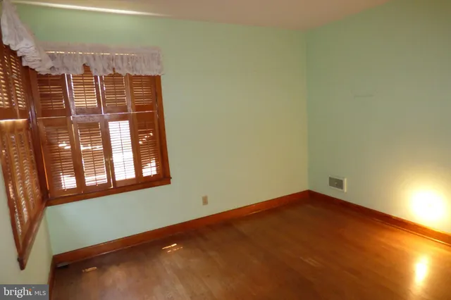 a view of a room with a large window