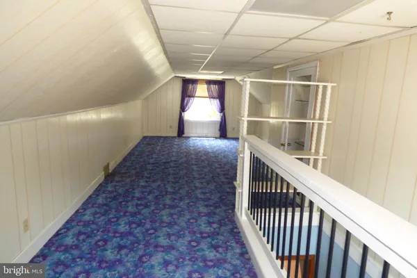 a view of empty room with floor to ceiling window