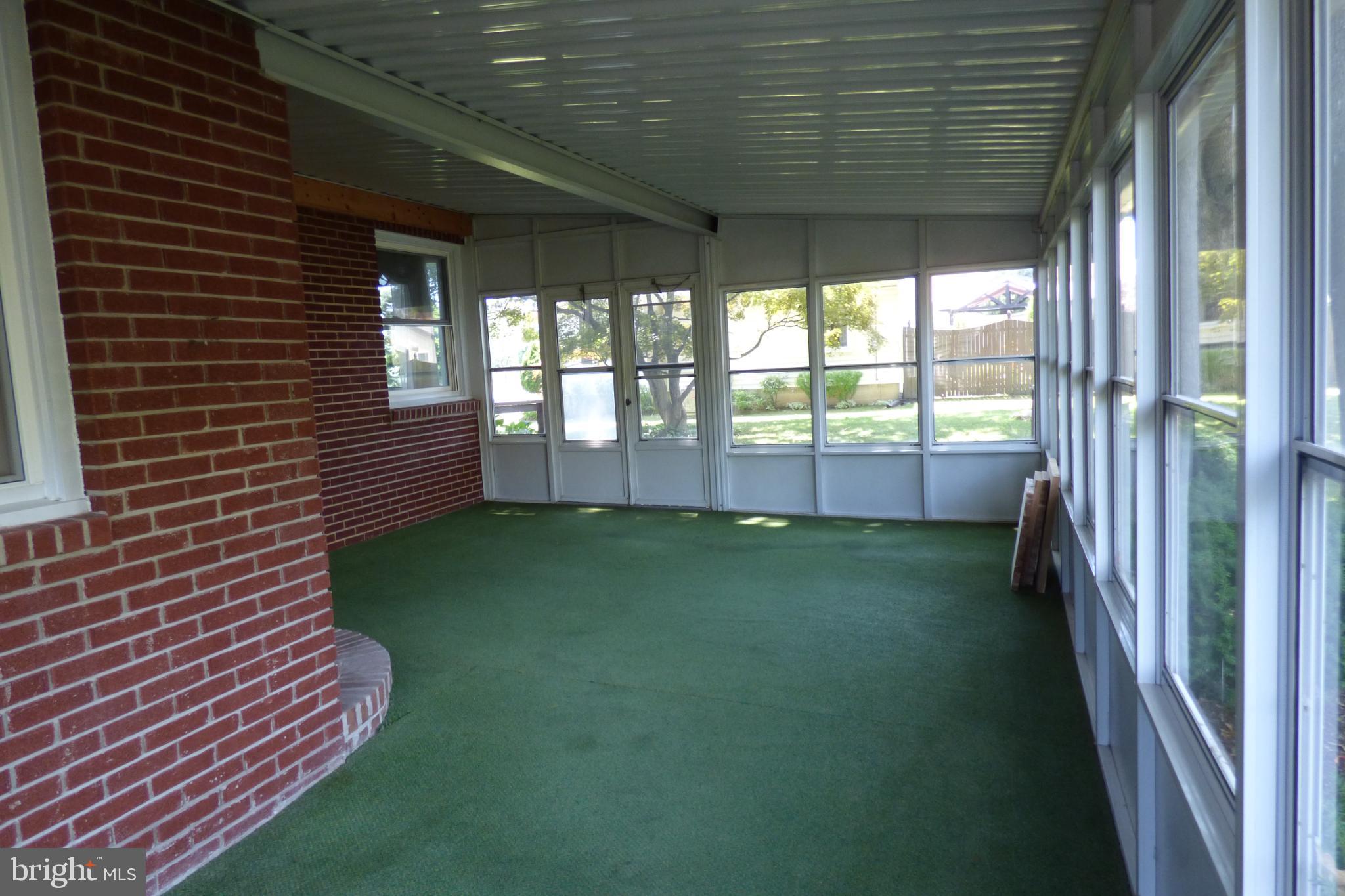430 Moul Avenue Hanover, PA 17331 - Photo 26 of 30 Bright and airy sunroom with green carpet.