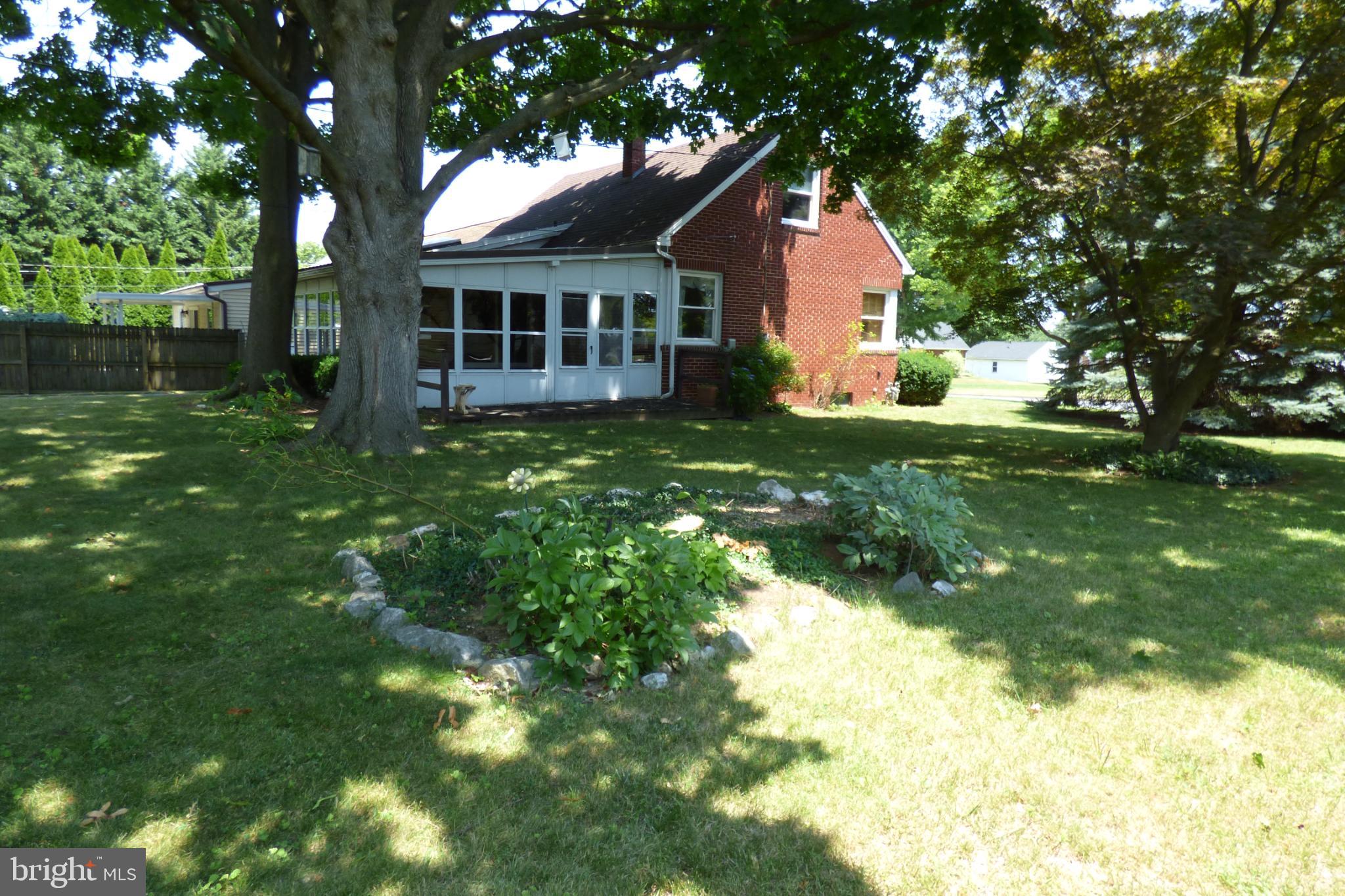 430 Moul Avenue Hanover, PA 17331 - Photo 30 of 30 Charming brick home nestled in lush greenery.