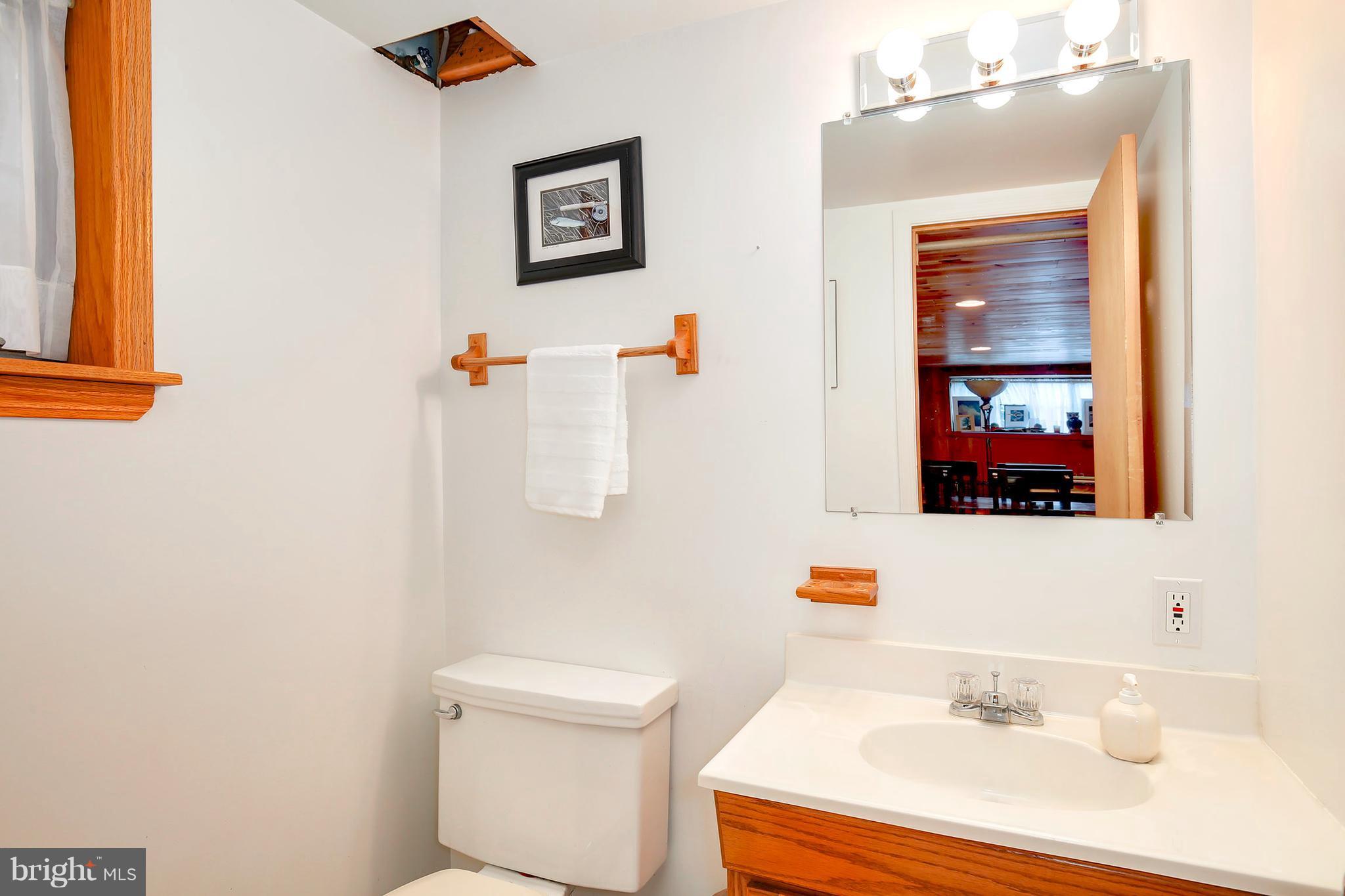 5304 Ravensworth Road Springfield, VA 22151 - Photo 13 of 30 a bathroom with a sink and a mirror