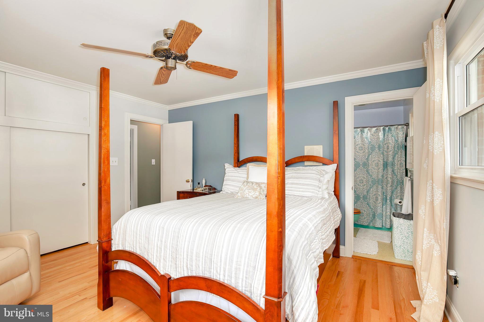 5304 Ravensworth Road Springfield, VA 22151 - Photo 16 of 30 a bedroom with a bed and wooden floor