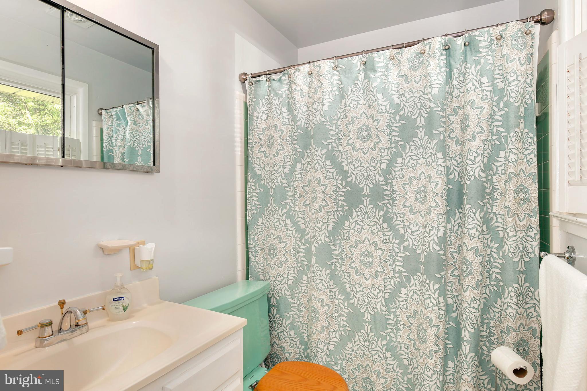5304 Ravensworth Road Springfield, VA 22151 - Photo 17 of 30 a bathroom with a sink and a mirror