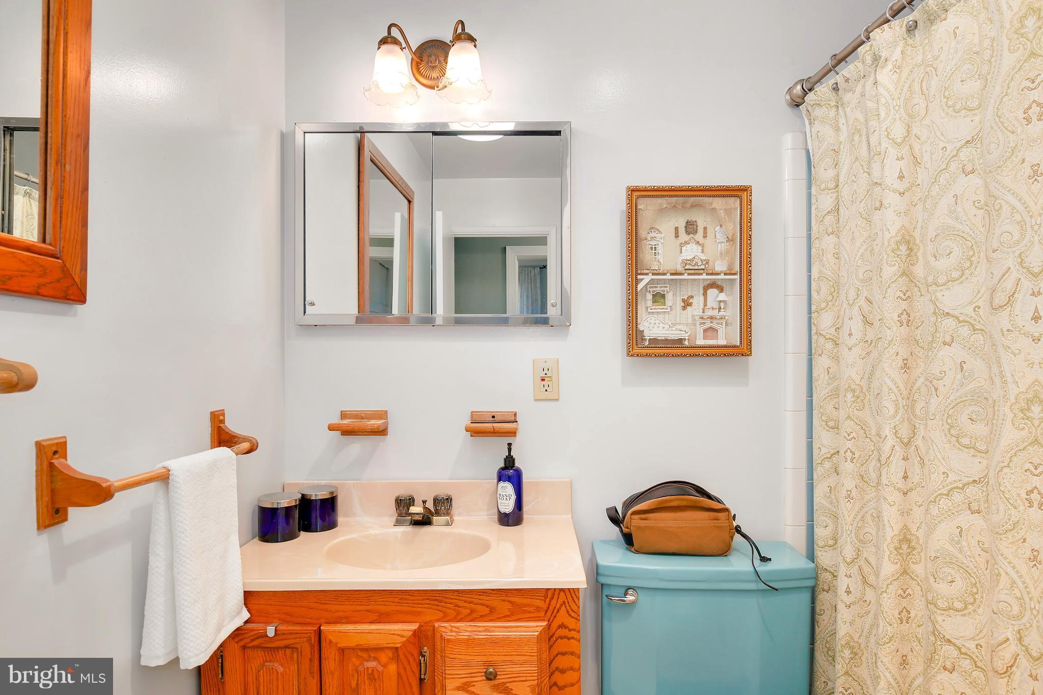 5304 Ravensworth Road Springfield, VA 22151 - Photo 20 of 30 a bathroom with a sink and a mirror