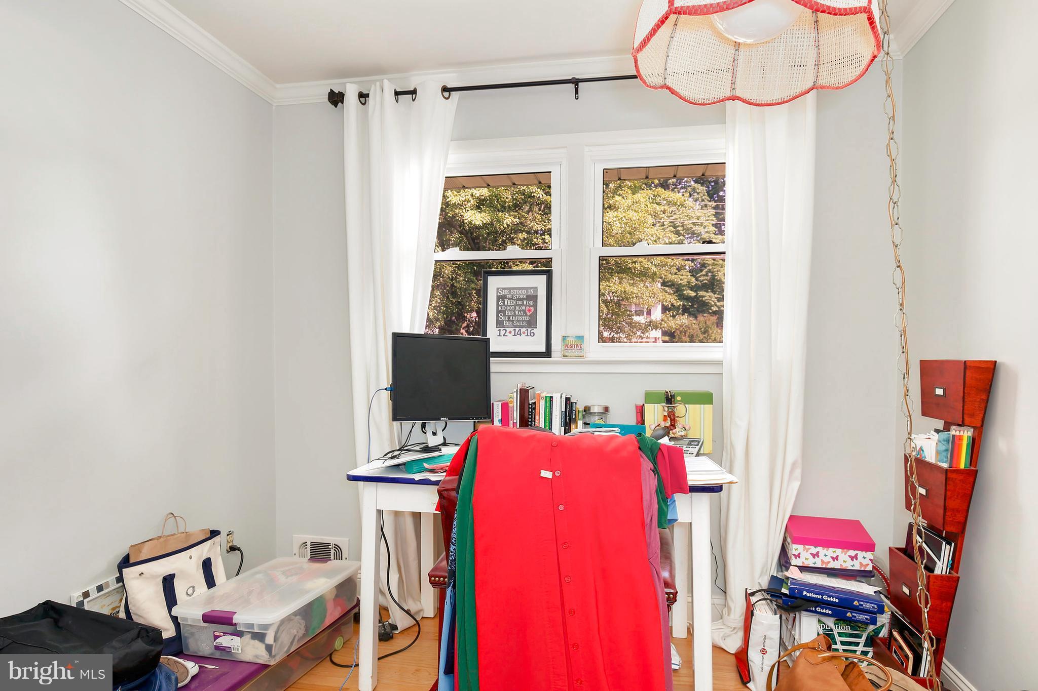 5304 Ravensworth Road Springfield, VA 22151 - Photo 21 of 30 a view of a workspace with furniture and a window