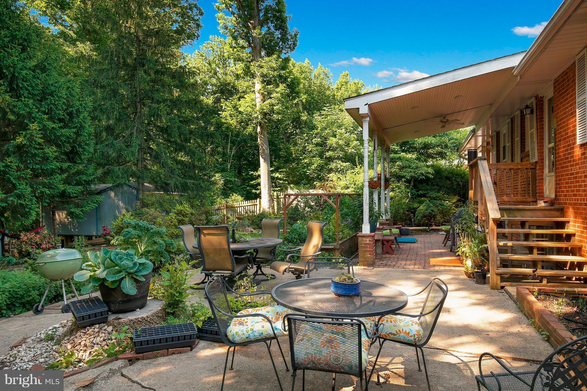 5304 Ravensworth Road Springfield, VA 22151 - Photo 28 of 30 a view of backyard with outdoor seating and plants