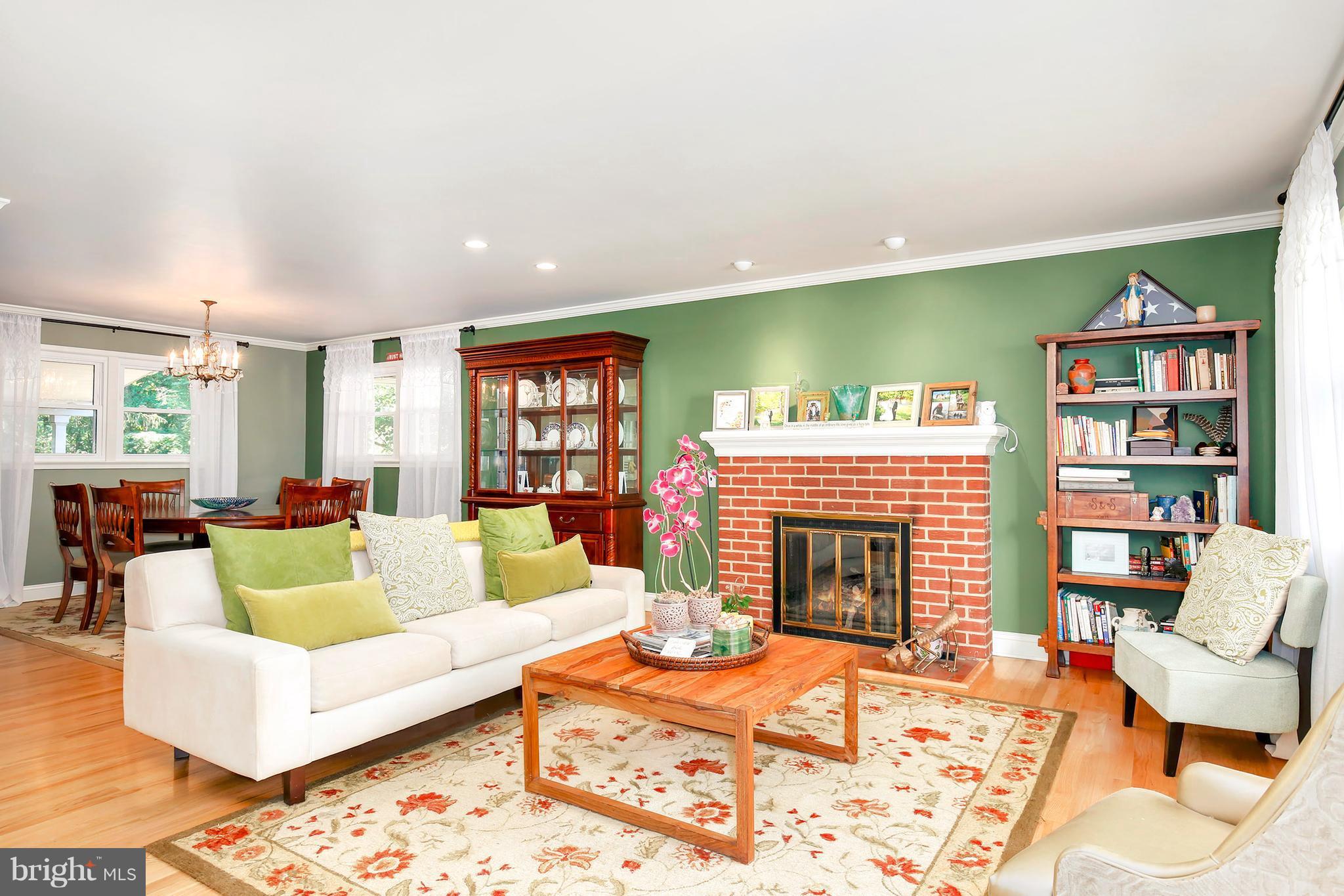 5304 Ravensworth Road Springfield, VA 22151 - Photo 4 of 30 a living room with furniture and a fireplace
