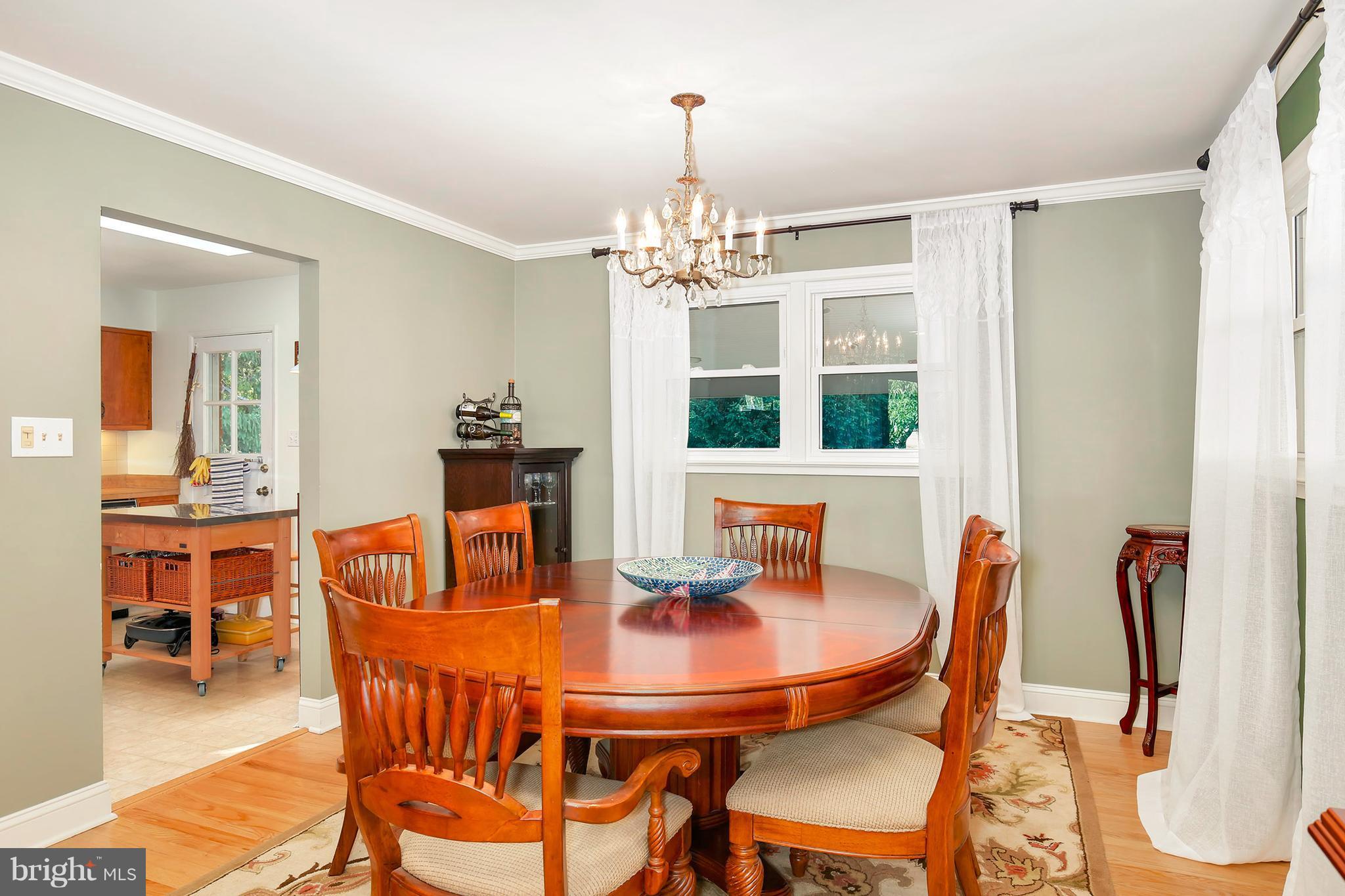 5304 Ravensworth Road Springfield, VA 22151 - Photo 8 of 30 a view of a dining room with furniture and wooden floor