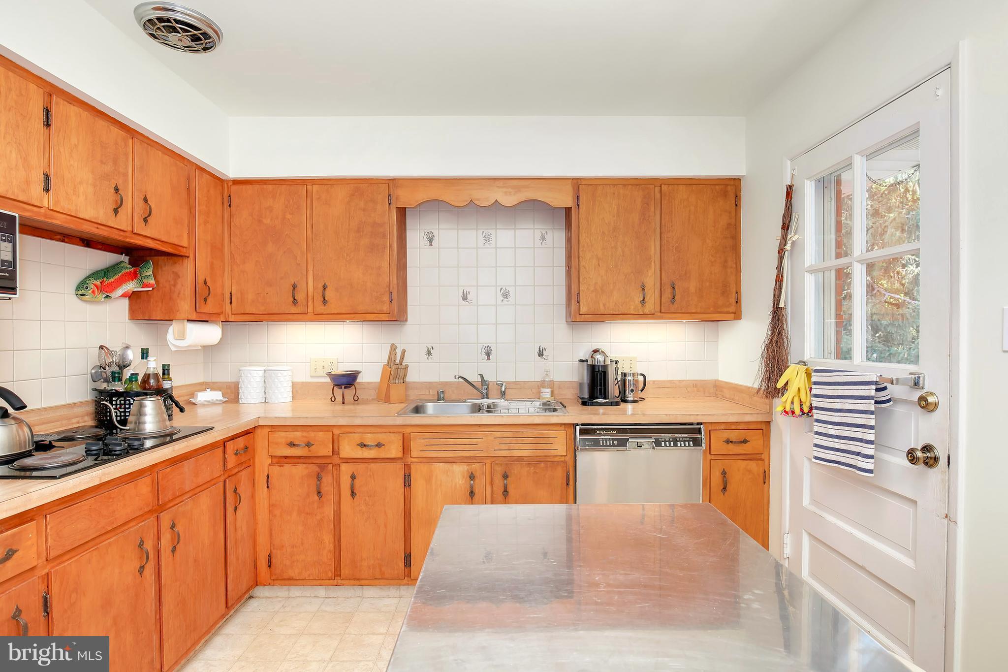 5304 Ravensworth Road Springfield, VA 22151 - Photo 10 of 30 a large kitchen with stainless steel appliances granite countertop a stove a sink dishwasher and cabinets with wooden floor