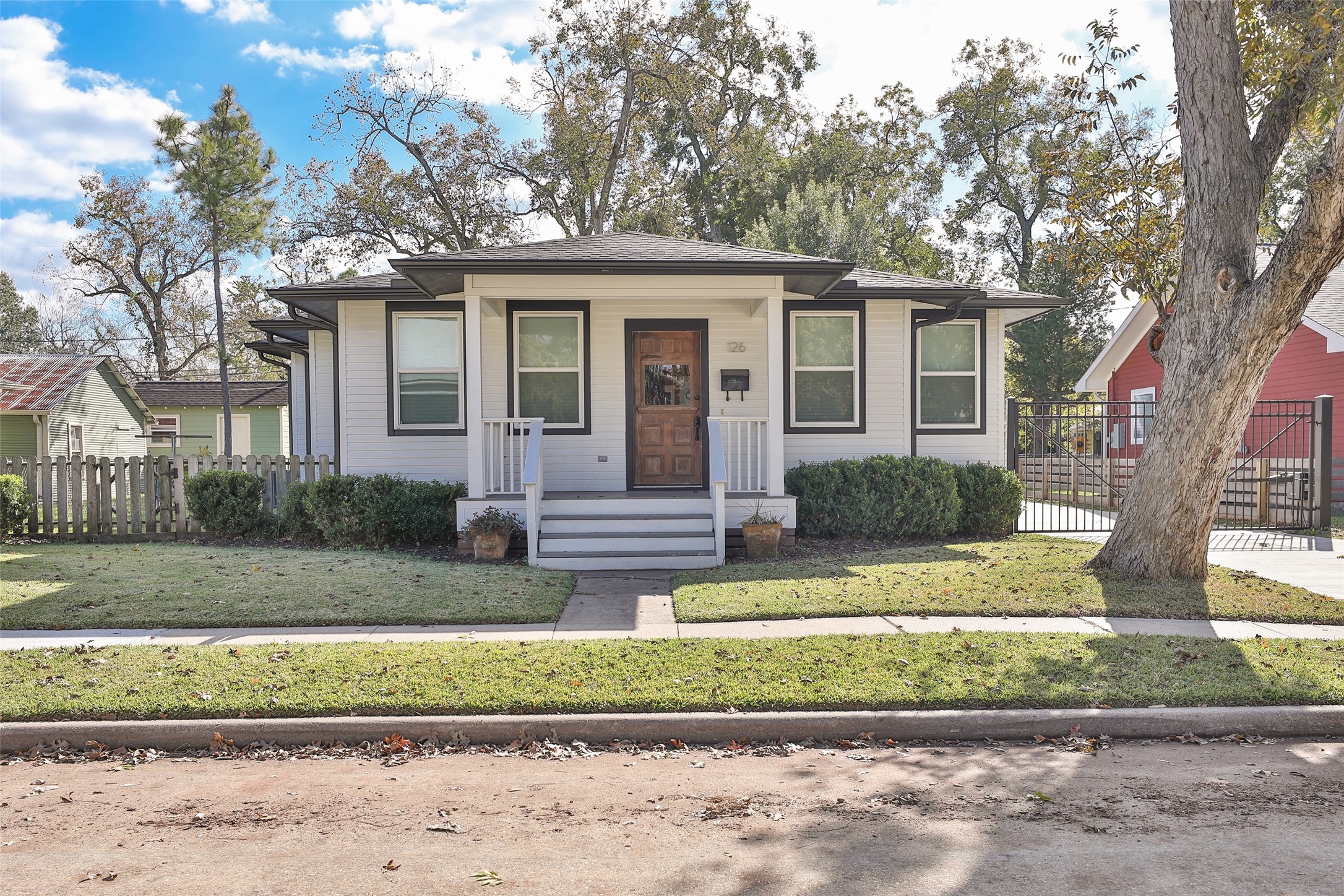 126 2nd Street Sugar Land, TX 77498 - Photo 2 of 50 a front view of a house with a yard