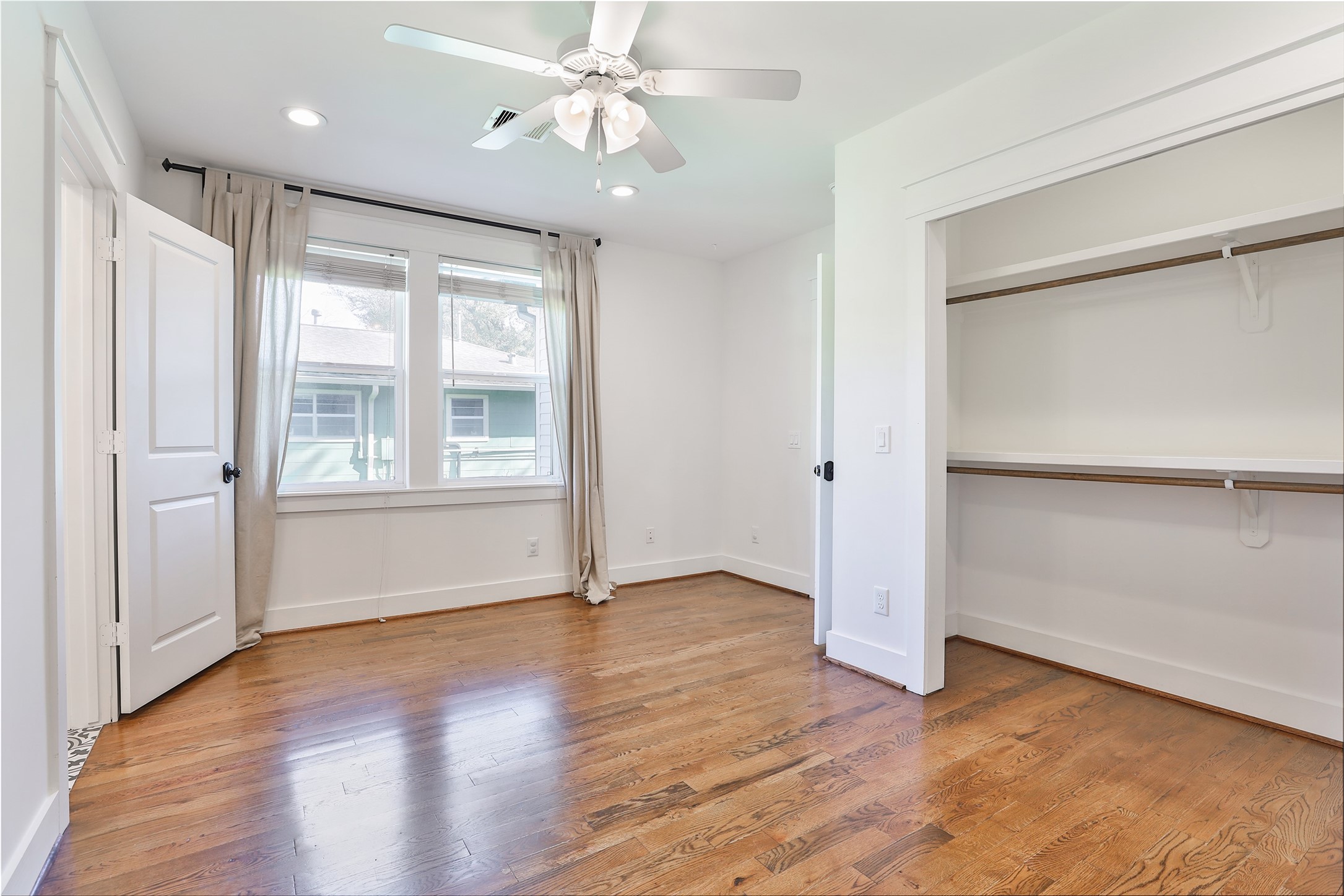 126 2nd Street Sugar Land, TX 77498 - Photo 36 of 50 a view of an empty room with a window and wooden floor