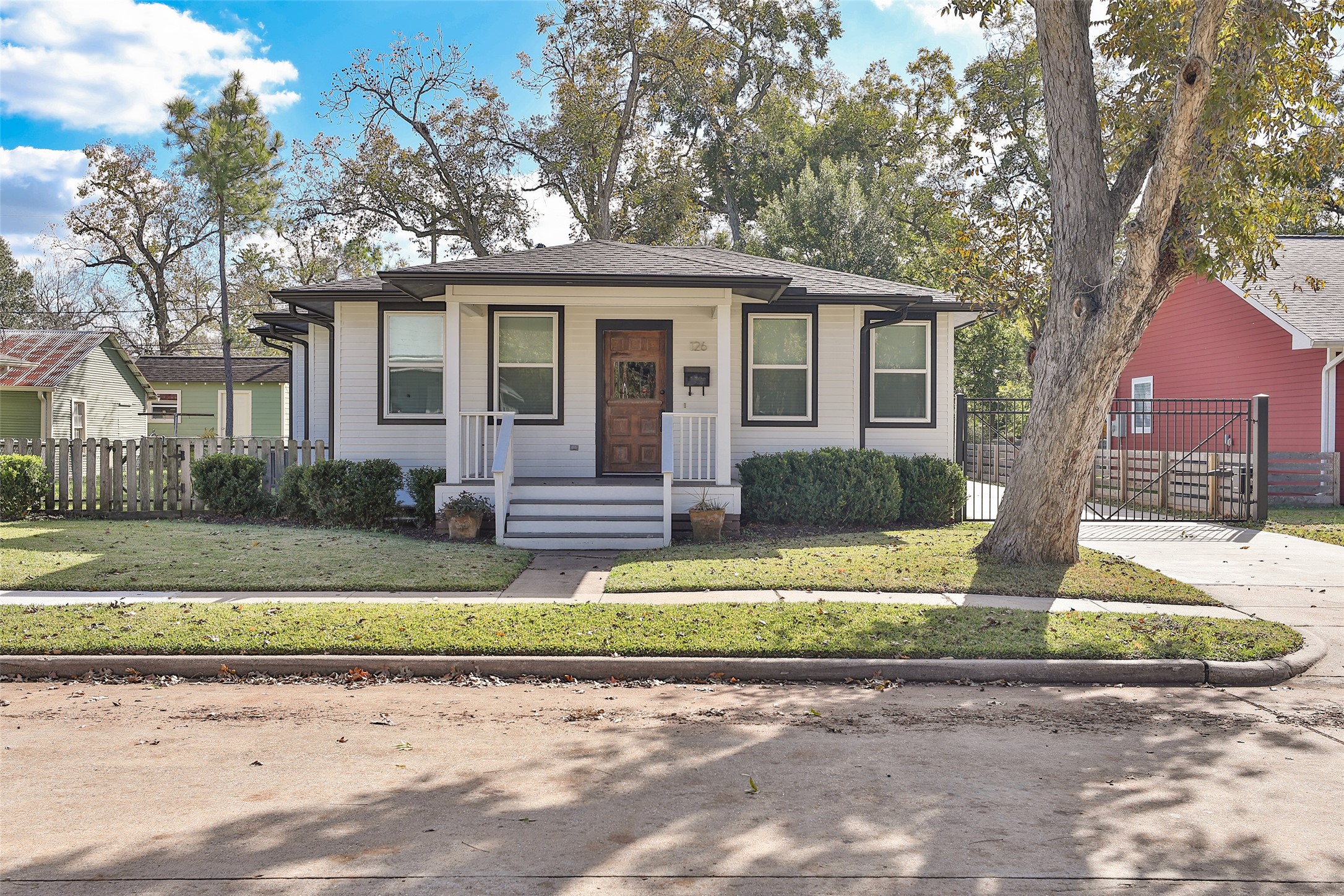 126 2nd Street Sugar Land, TX 77498 - Photo 4 of 50 a front view of a house with a yard and porch