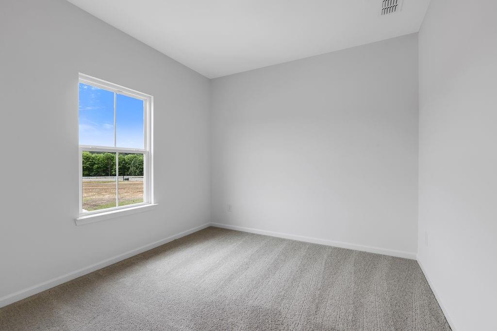 172 Sweet Water Lane Southeast Rome, GA 30161 - Photo 11 of 29 an empty room with a window