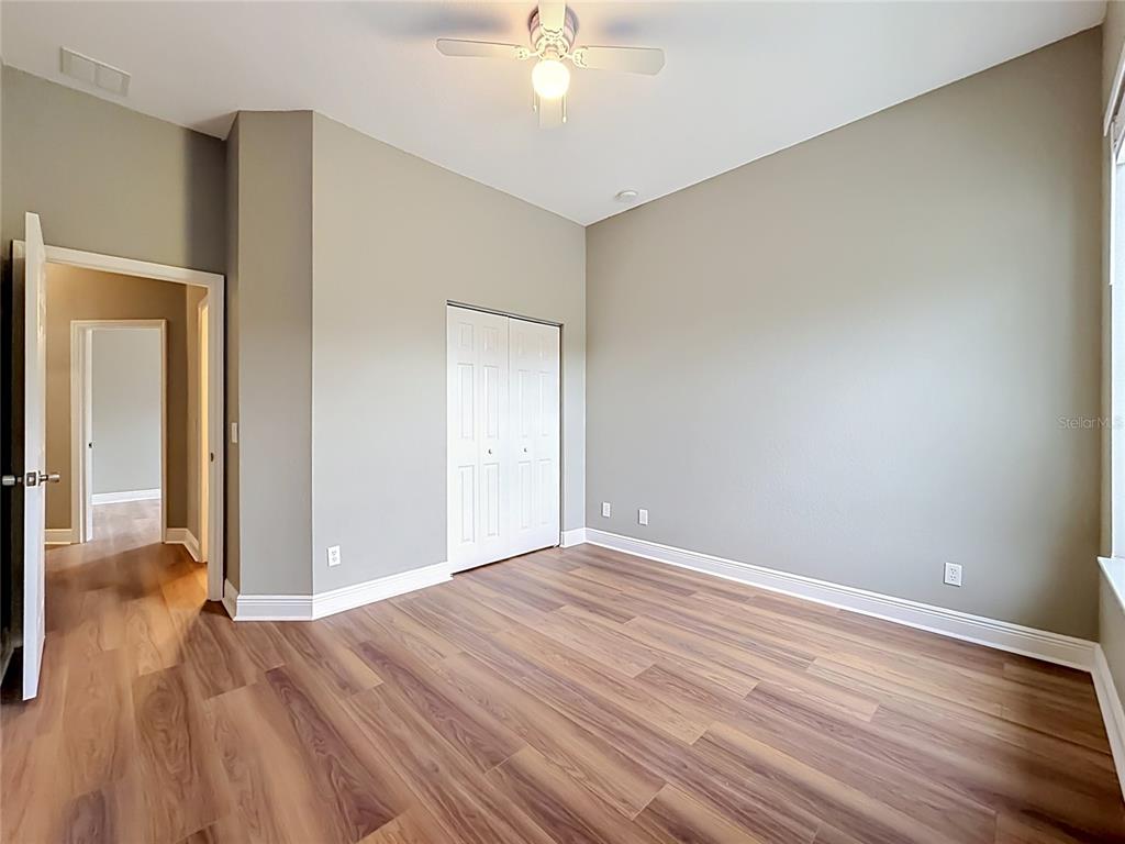28549 Shirley Shores Road Tavares, FL 32778 - Photo 37 of 65 a view of an empty room with wooden floor