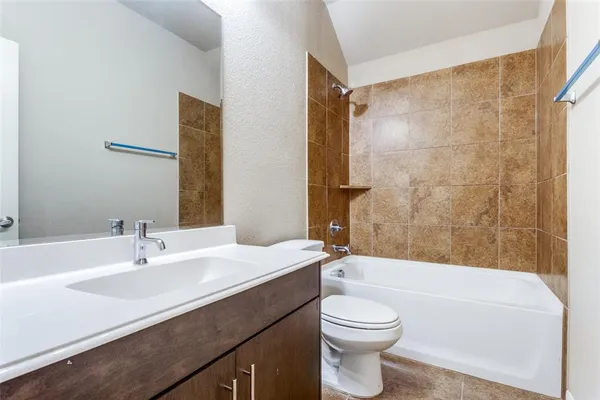 a bathroom with a sink a toilet and a bathtub