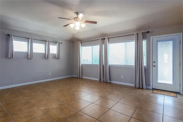 a view of an empty room with a window