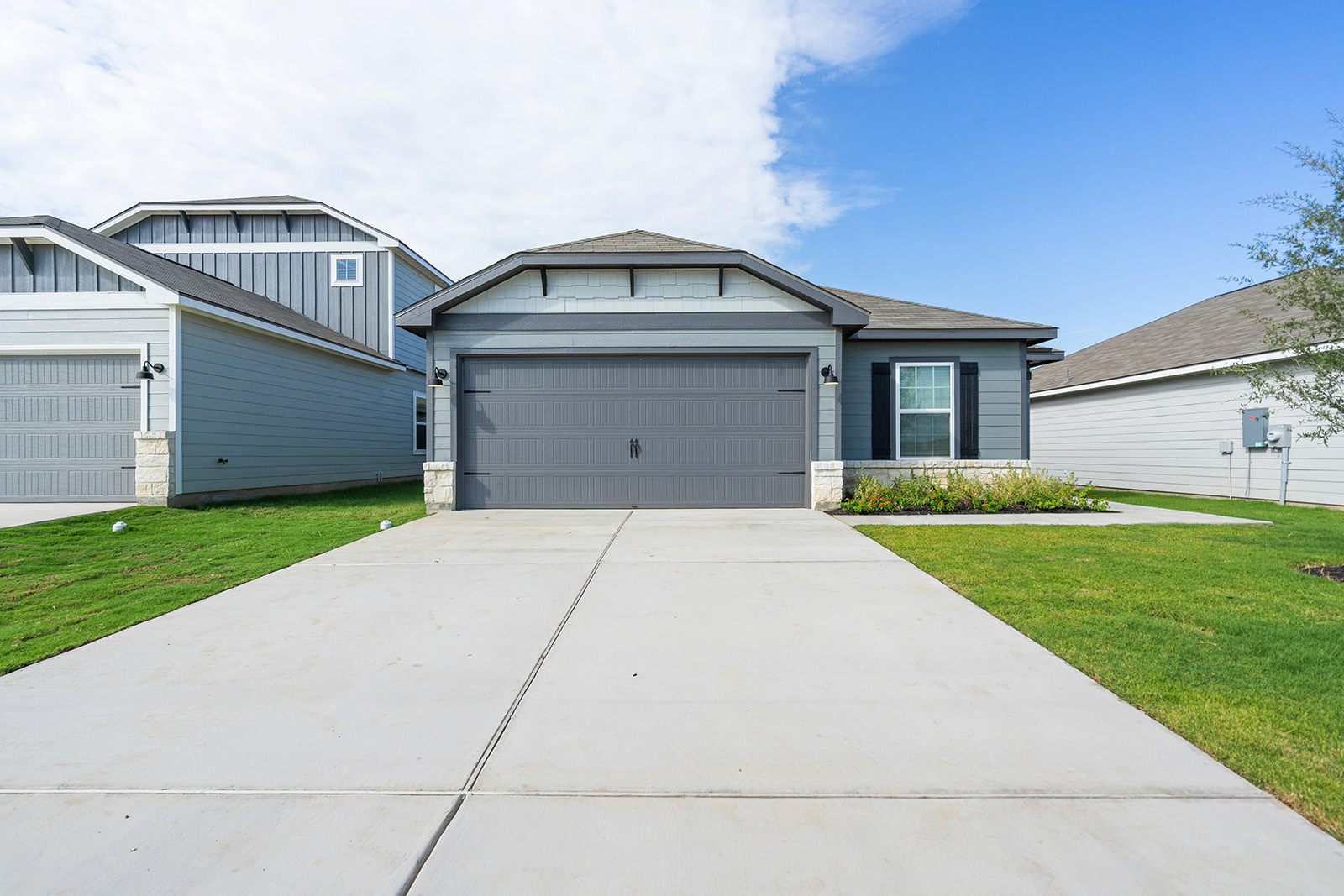 a front view of house with yard and green space