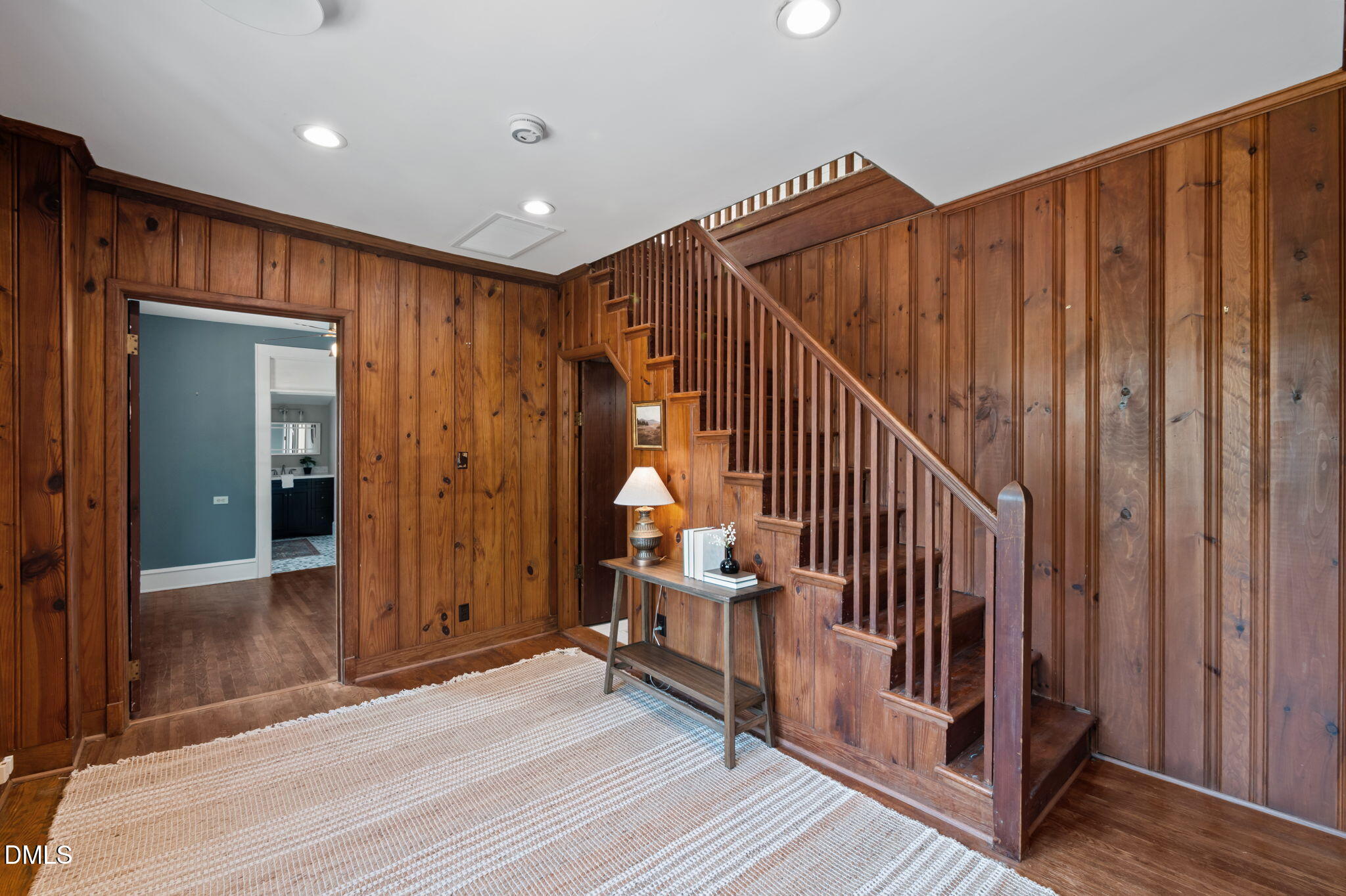 7923 Morrow Mill Road Chapel Hill, NC 27516 - Photo 29 of 66 a view of a hallway with wooden floor and staircase