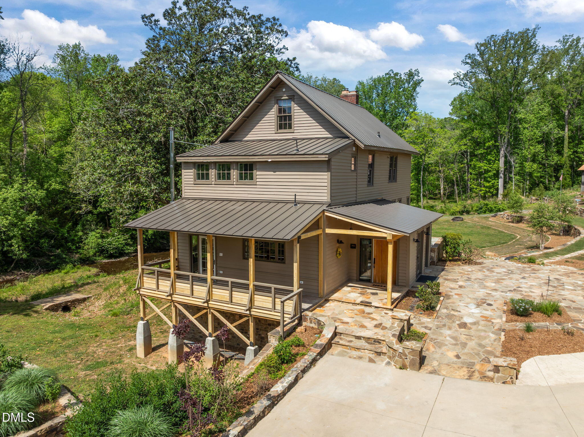 7923 Morrow Mill Road Chapel Hill, NC 27516 - Photo 3 of 66 a front view of a house with a yard