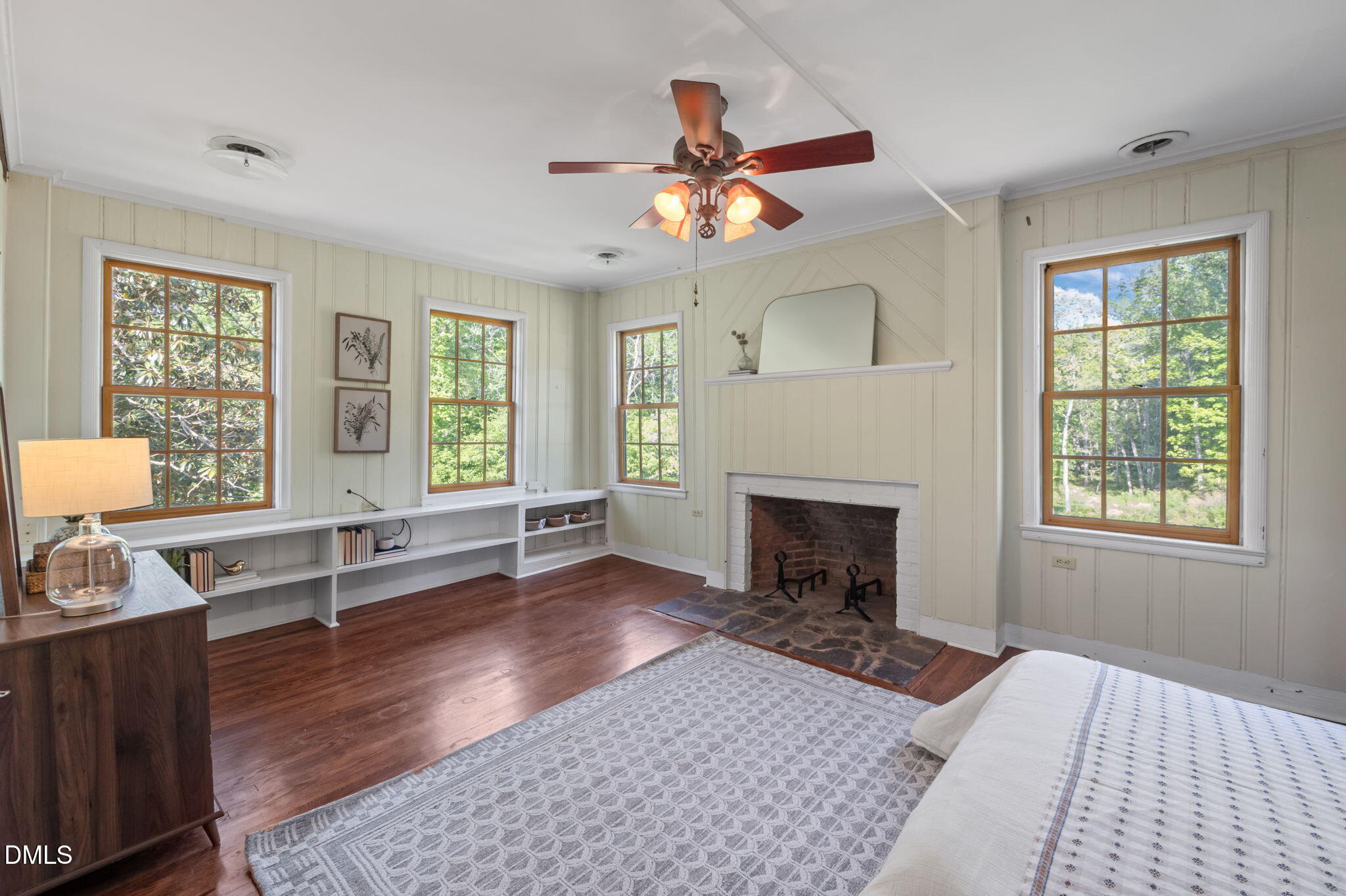 7923 Morrow Mill Road Chapel Hill, NC 27516 - Photo 32 of 66 a living room with furniture a fireplace and windows