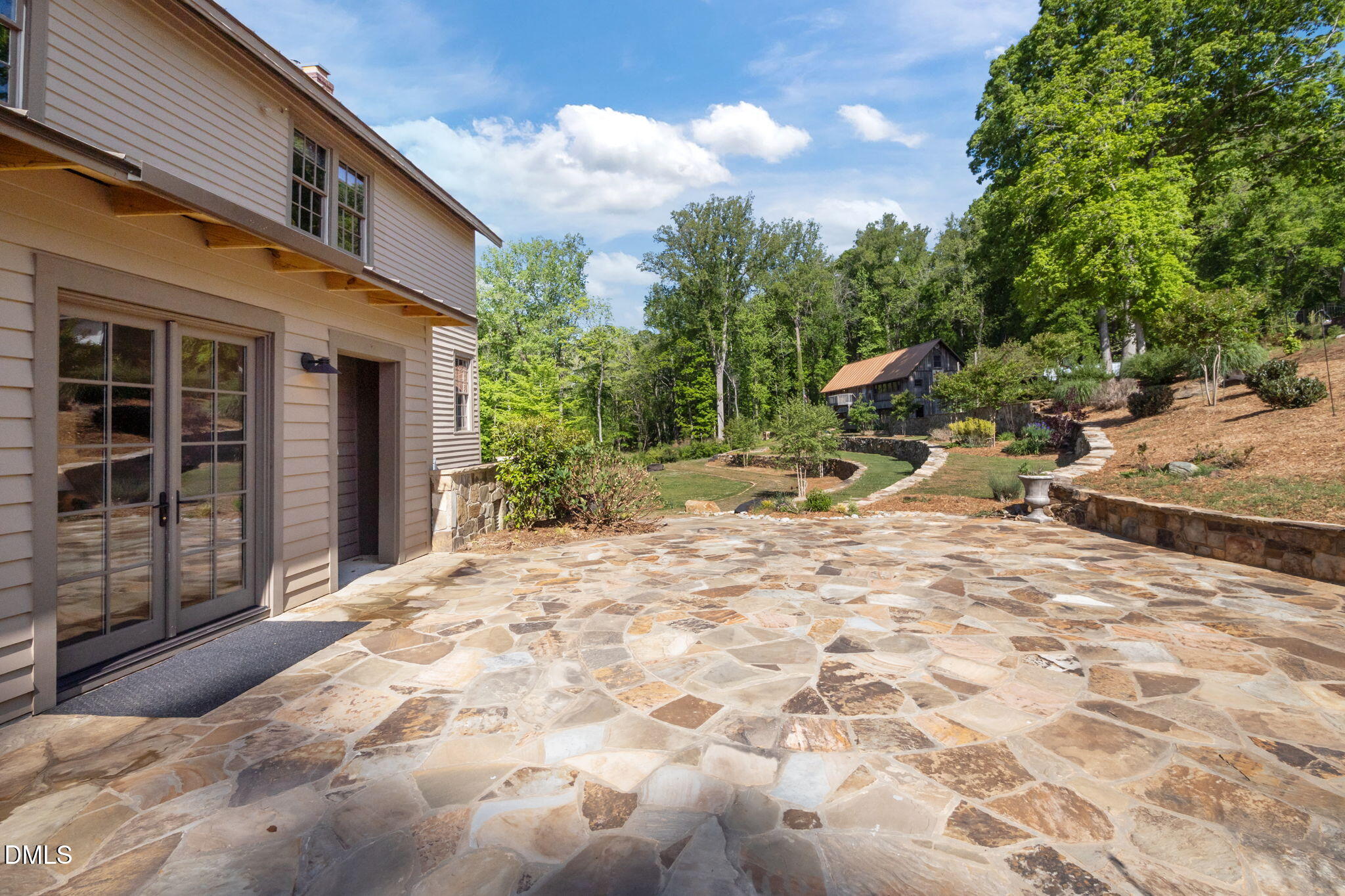 7923 Morrow Mill Road Chapel Hill, NC 27516 - Photo 36 of 66 a view of backyard with wheel chair and potted plants