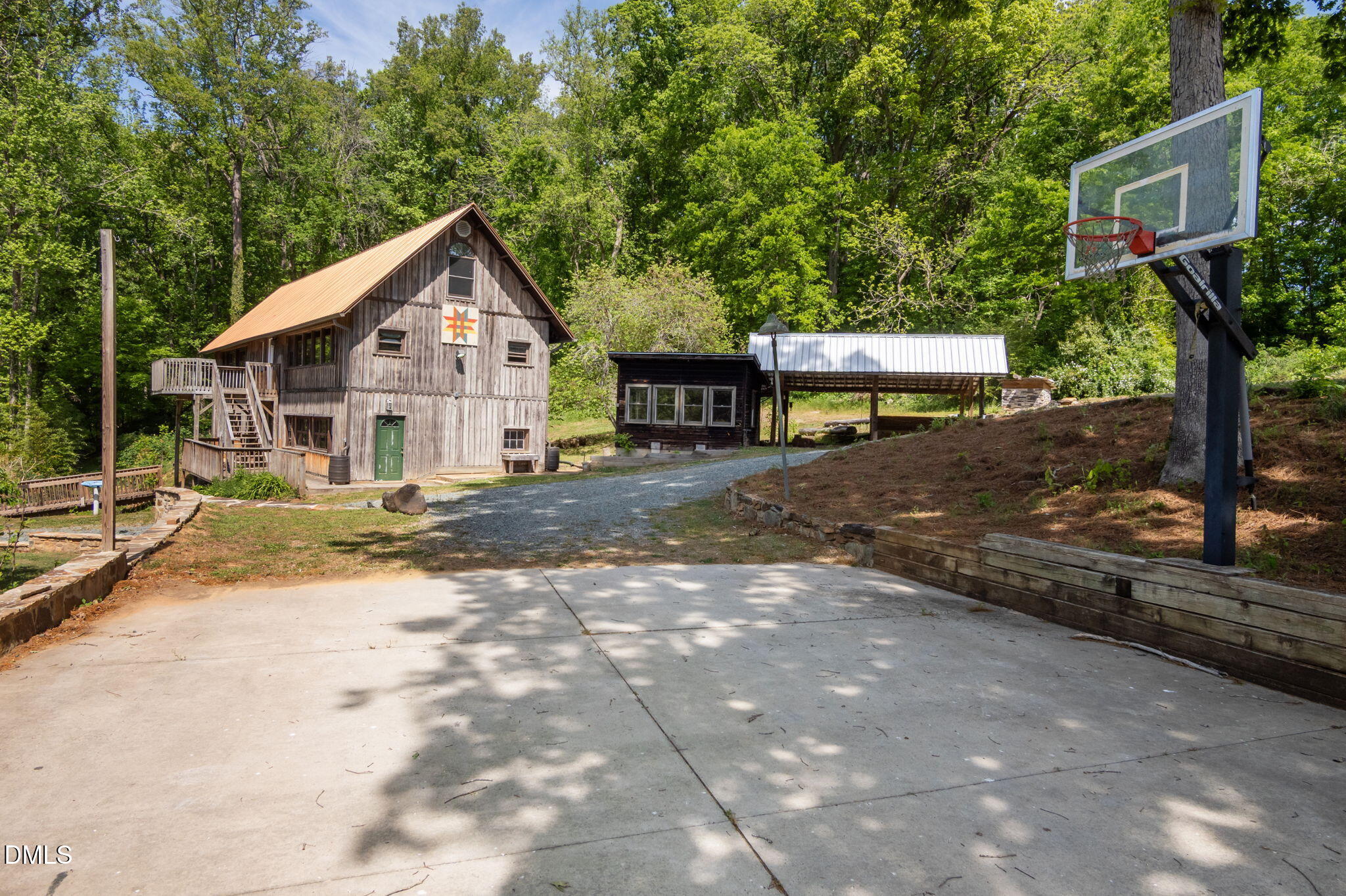 7923 Morrow Mill Road Chapel Hill, NC 27516 - Photo 49 of 66 a view of a house with backyard and trees