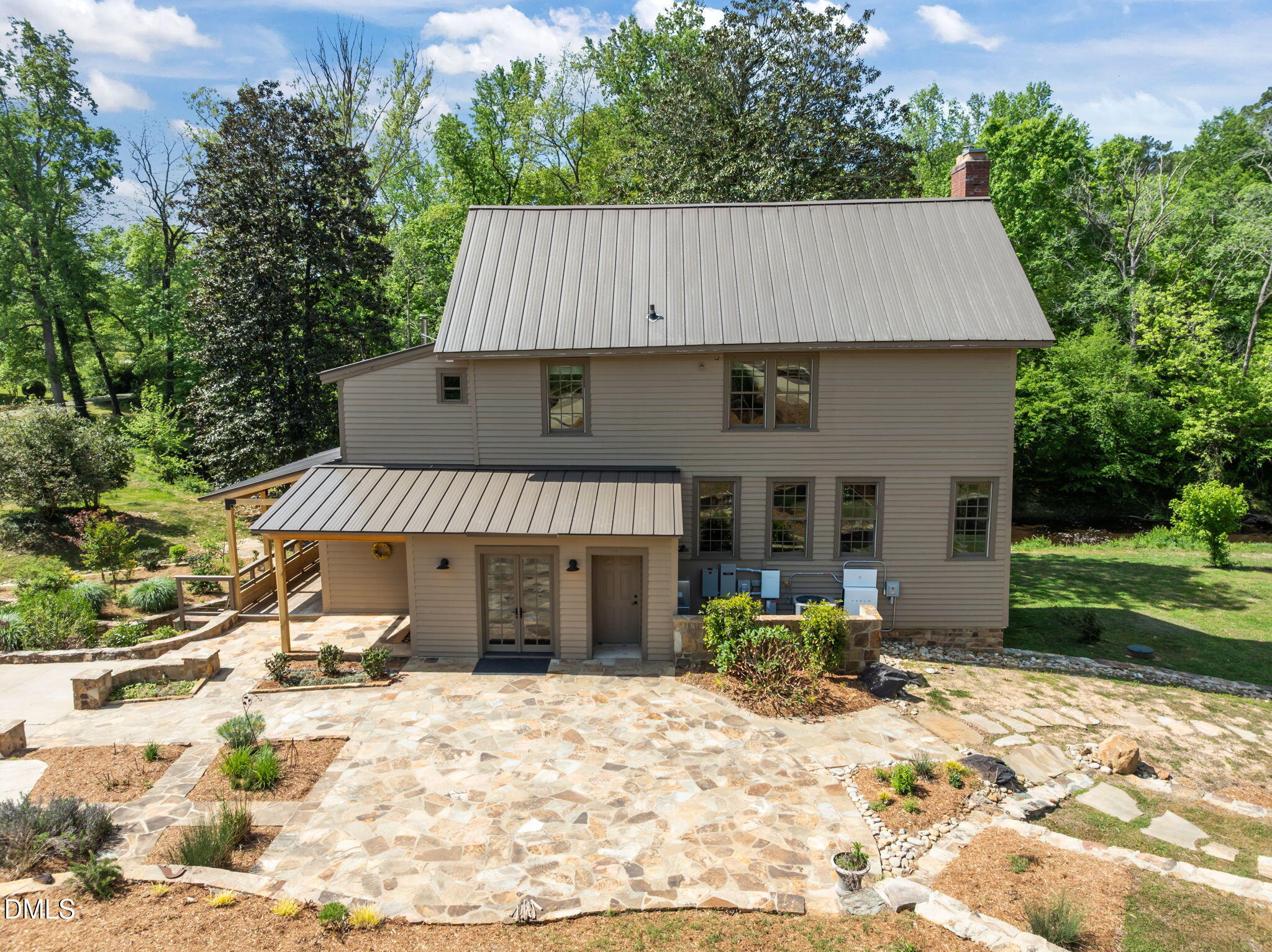 7923 Morrow Mill Road Chapel Hill, NC 27516 - Photo 5 of 66 a front view of a house with yard and seating space