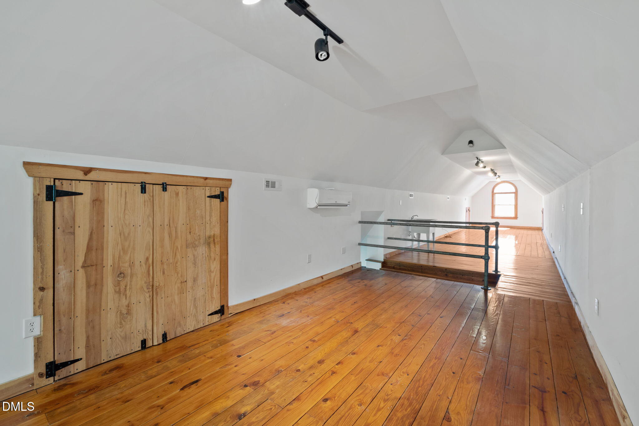 7923 Morrow Mill Road Chapel Hill, NC 27516 - Photo 55 of 66 a view of a room with wooden floor and white walls