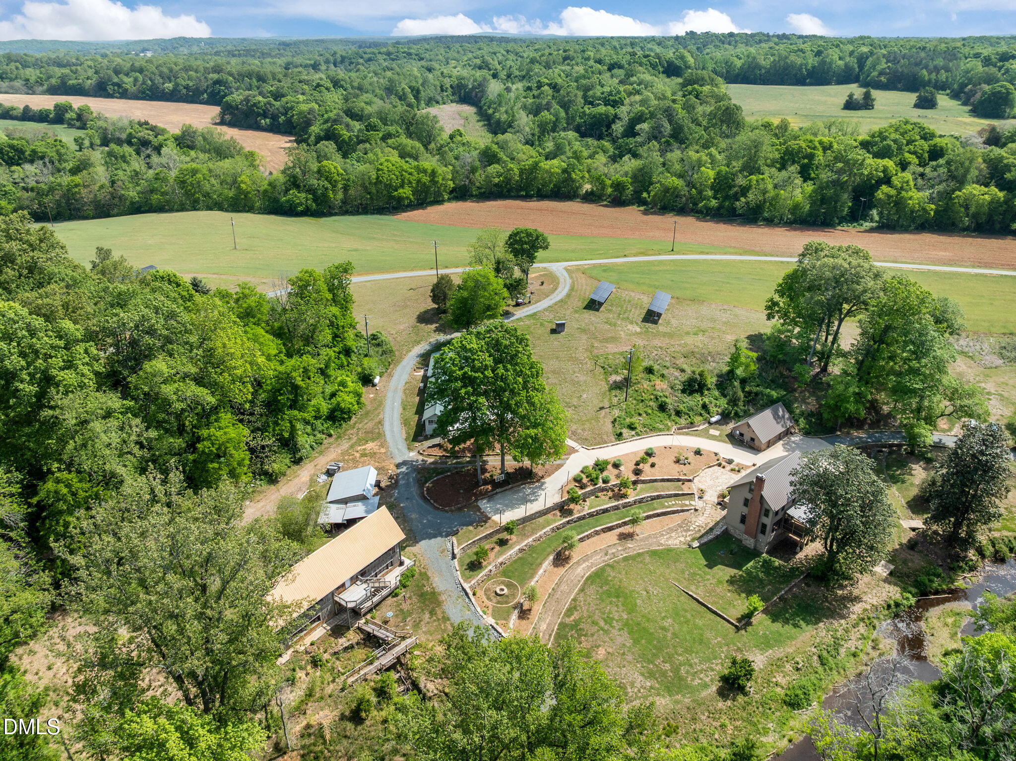 7923 Morrow Mill Road Chapel Hill, NC 27516 - Photo 61 of 66 an aerial view of a house with a yard and lake view