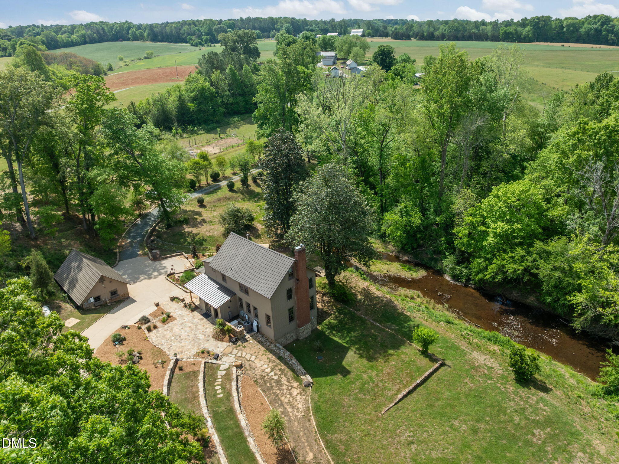 7923 Morrow Mill Road Chapel Hill, NC 27516 - Photo 7 of 66 an aerial view of a residential houses with outdoor space and trees