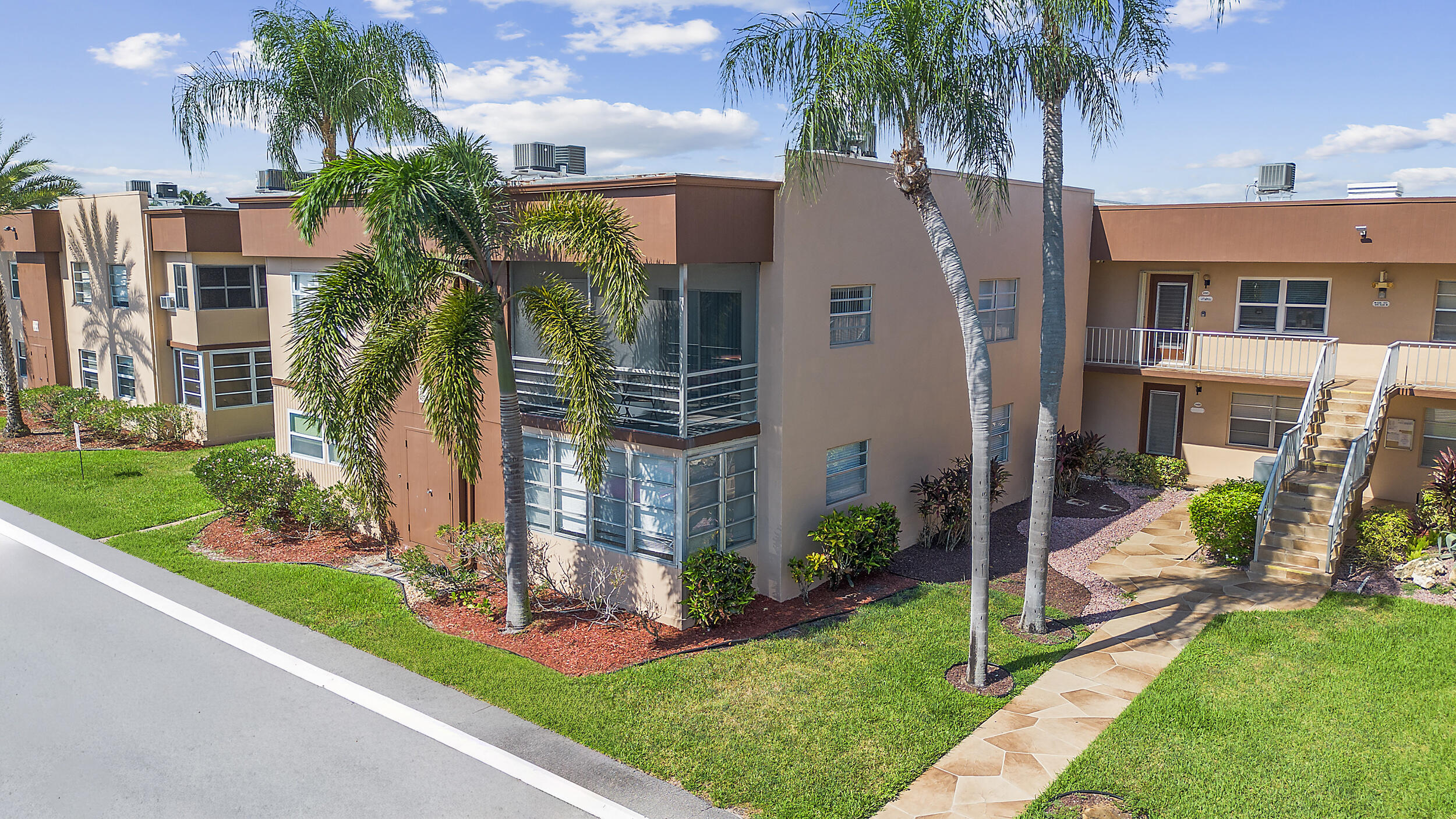 488 Burgundy P Delray Beach, FL 33484 - Photo 24 of 33 a aerial view of a house with a yard and potted plants