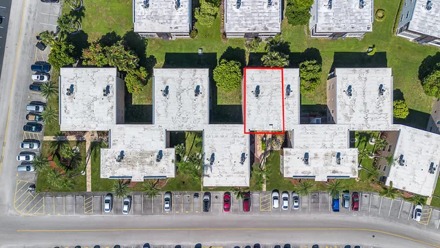 an aerial view of multiple houses with outdoor space