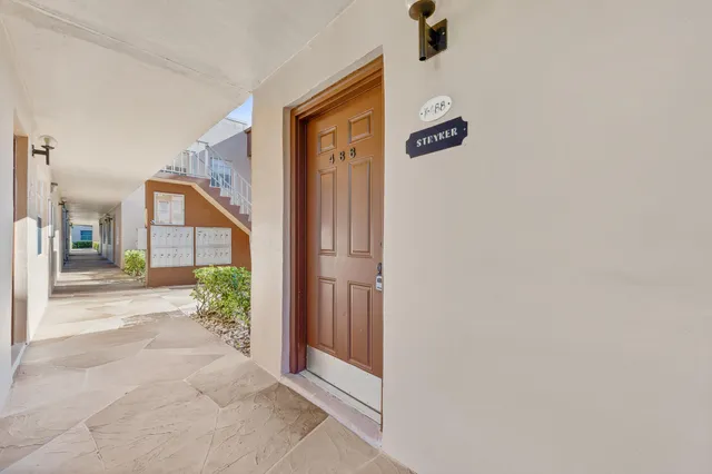 a view of a pathway along the house