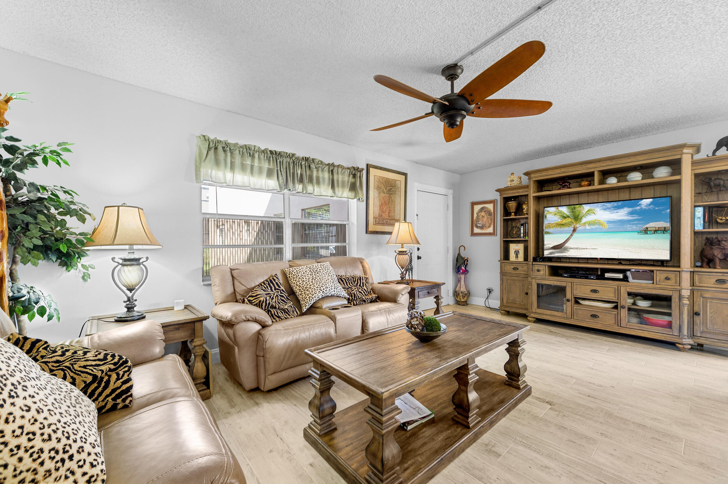 488 Burgundy P Delray Beach, FL 33484 - Photo 5 of 33 a living room with furniture and a flat screen tv