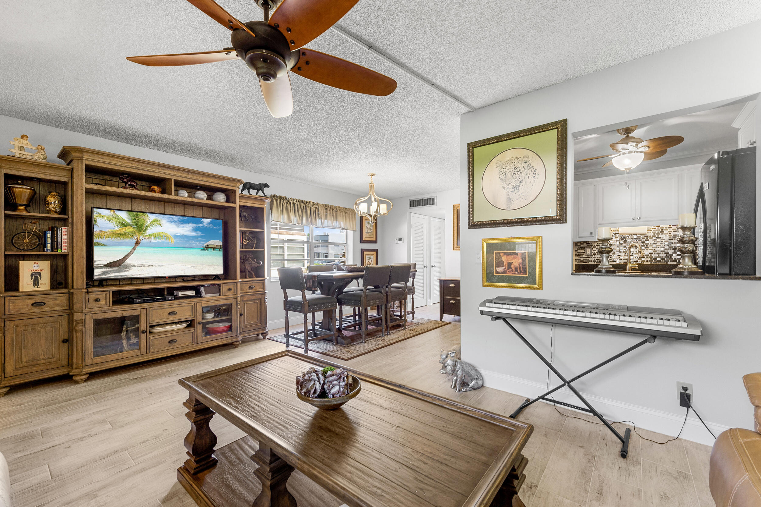 488 Burgundy P Delray Beach, FL 33484 - Photo 6 of 33 a living room with furniture and a flat screen tv