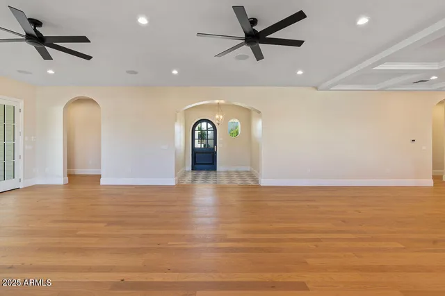 a kitchen with stainless steel appliances granite countertop a stove and a wooden floors