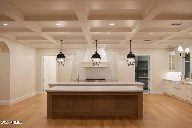a room with window and chandelier