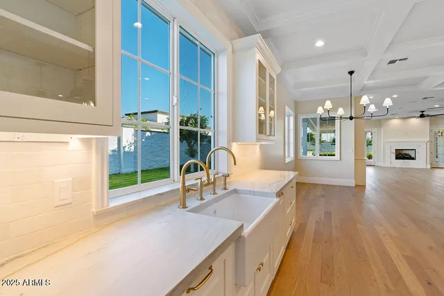 a view of a hallway with wooden floor and a corridor