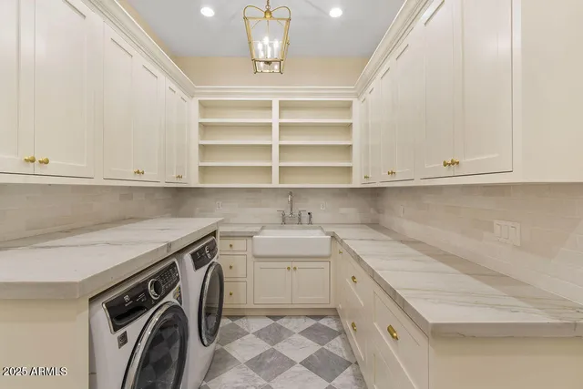 an empty room with wooden floor closet and windows