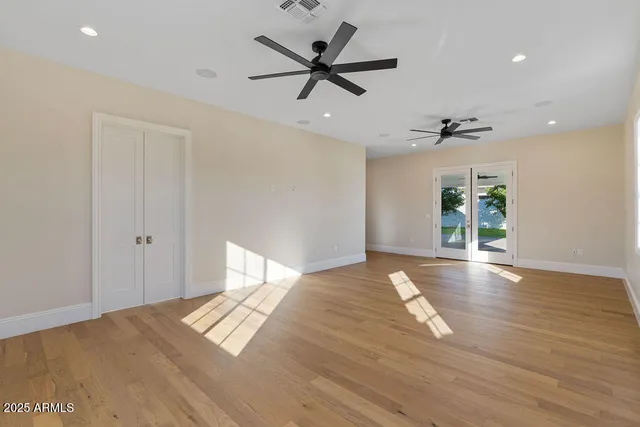 a bathroom with a granite countertop toilet and a sink