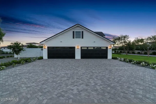 a front view of house with garage and yard