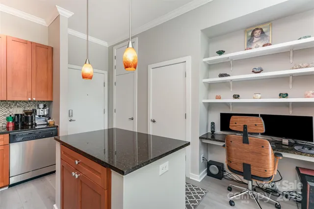 a kitchen with a sink cabinets and window